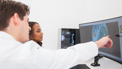 Dentist showing a patient an x ray of their teeth
