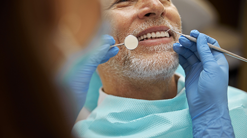 Senior man getting a dental exam