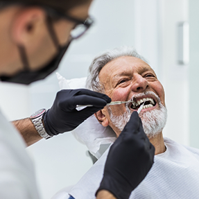 Senior man getting a dental exam