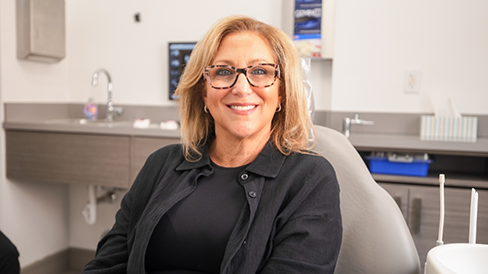 Blonde woman smiling in the dental chair