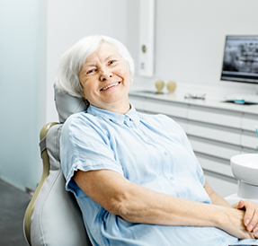 Senior woman smiling in the dental chair
