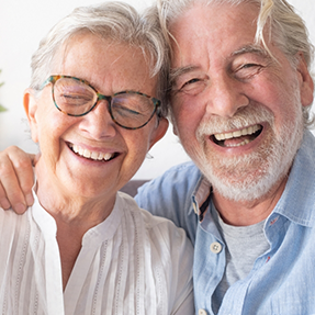 Senior couple grinning