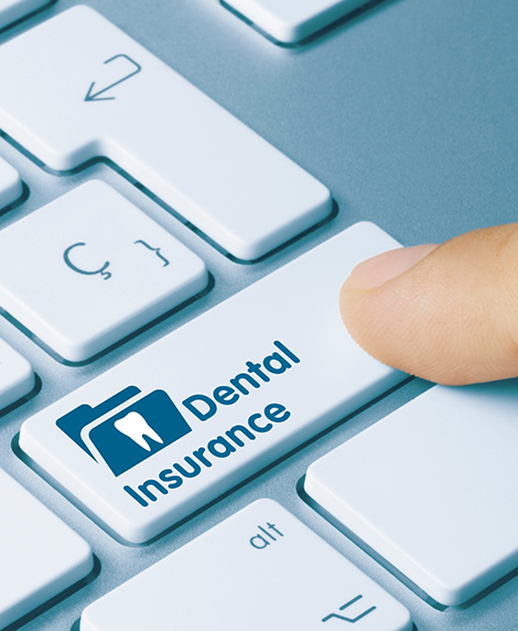 Person pressing a button labeled dental insurance