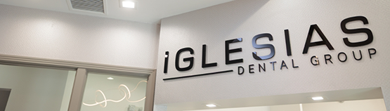 Iglesias Dental Group sign on the wall of a dental office near Parkland