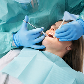 Woman receiving gum treatment