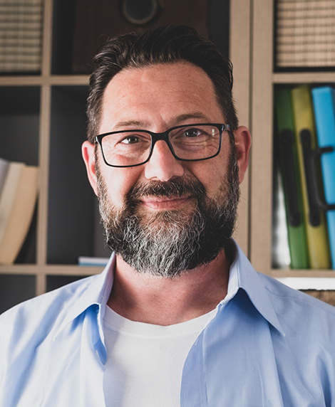 Bearded man smiling after restorative dentistry in Coral Springs