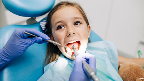 Young girl getting a dental checkup