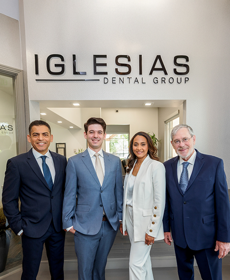Four smiling Coral Springs dentists at Iglesias Dental Group