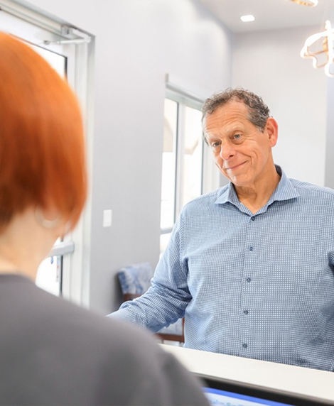 Man checking in at a dental office in Coral Springs