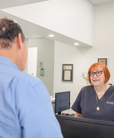 Man checking in at a dental office in Coral Springs