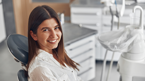 Woman smiling in the dental chair