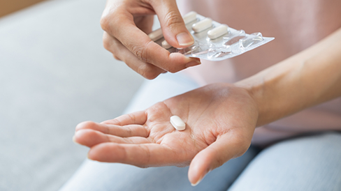 Person taking a pill
